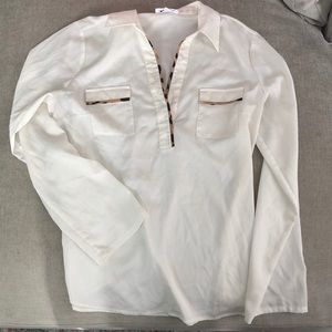 Long sleeve v-neck CK blouse.